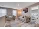 Relaxing upstairs loft with cozy sofas and a view into the main bedroom at 1637 Harvest Pecan Ct, Las Vegas, NV 89108