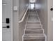 Staircase featuring wood-look steps and white railings at 1637 Harvest Pecan Ct, Las Vegas, NV 89108