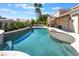 Inviting backyard pool area, landscaped patio, and lush greenery offer a serene retreat at 188 Carthage St, Henderson, NV 89074