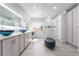 Bright bathroom featuring dual sinks, vanity area, and glass enclosed shower at 188 Carthage St, Henderson, NV 89074