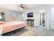 Primary bedroom boasts wood floors, shutters, and a ceiling fan at 188 Carthage St, Henderson, NV 89074
