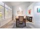 Elegant dining room with natural light, wood table, and stylish décor at 188 Carthage St, Henderson, NV 89074