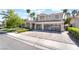 Beautiful two-story home with well-maintained landscaping, a three-car garage, and a spacious driveway at 188 Carthage St, Henderson, NV 89074