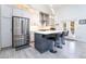 Modern kitchen featuring stainless steel appliances, an island with seating, and ample counter space at 188 Carthage St, Henderson, NV 89074