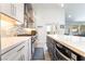 Modern kitchen features stainless steel appliances, stone countertops, and tiled backsplash at 188 Carthage St, Henderson, NV 89074