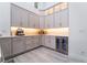 Modern kitchen features custom cabinetry, quartz countertops, and stainless steel beverage cooler at 188 Carthage St, Henderson, NV 89074