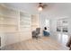 Spacious living room features custom built-ins, recessed lighting, and large glass doors at 188 Carthage St, Henderson, NV 89074