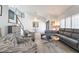 Stylish living room features modern furnishings, a staircase, and abundant natural light at 188 Carthage St, Henderson, NV 89074
