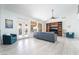 Bright living room with large windows, modern decor, and access to the outdoor pool at 188 Carthage St, Henderson, NV 89074