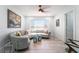 Inviting living room showcasing a curved sofa, seahorse stools, and bright windows at 188 Carthage St, Henderson, NV 89074