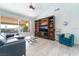 Cozy living room with built-in shelving, comfortable seating, and large windows at 188 Carthage St, Henderson, NV 89074