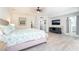Large main bedroom featuring a ceiling fan, tv and access to the main bathroom at 188 Carthage St, Henderson, NV 89074