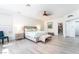 Large bedroom featuring wood laminate floors, ceiling fan and ensuite walk-in closet at 188 Carthage St, Henderson, NV 89074