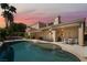 Beautiful backyard pool with covered patio and seating area, perfect for outdoor relaxation and entertaining at 188 Carthage St, Henderson, NV 89074