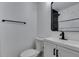 Stylish bathroom with black fixtures, modern vanity, and tiled shower at 212 View Dr, Las Vegas, NV 89107