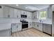 Modern kitchen features gray cabinets, stainless appliances, and sleek countertops at 212 View Dr, Las Vegas, NV 89107