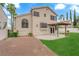 The backyard has green grass and a shaded patio at 2257 Norway Pine Ct, Las Vegas, NV 89134