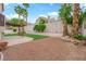 View of the backyard with decorative trees and gravel at 2257 Norway Pine Ct, Las Vegas, NV 89134
