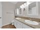Bathroom features double sinks with granite countertops and vanity storage at 2257 Norway Pine Ct, Las Vegas, NV 89134