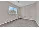 Bedroom with neutral carpet and a bright window at 2257 Norway Pine Ct, Las Vegas, NV 89134