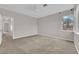 Bright bedroom with a ceiling fan and a window with a beautiful outside view at 2257 Norway Pine Ct, Las Vegas, NV 89134