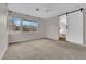 Spacious bedroom with barn door entry to ensuite bathroom and large windows at 2257 Norway Pine Ct, Las Vegas, NV 89134