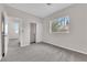 Bright bedroom featuring neutral paint, plush carpet, closet, and a window with outside views at 2257 Norway Pine Ct, Las Vegas, NV 89134