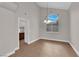 Bright dining room with tile floors, arched window, and neutral color palette at 2257 Norway Pine Ct, Las Vegas, NV 89134