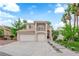 Charming two-story home featuring a spacious three-car garage and landscaped front yard with walkway at 2257 Norway Pine Ct, Las Vegas, NV 89134