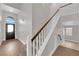 Bright foyer featuring tile floors, staircase and front entry door at 2257 Norway Pine Ct, Las Vegas, NV 89134
