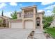 Inviting home with a two-car garage, balcony, and lush, well-maintained landscaping at 2257 Norway Pine Ct, Las Vegas, NV 89134