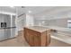 Well-equipped kitchen featuring granite countertops and stainless steel refrigerator at 2257 Norway Pine Ct, Las Vegas, NV 89134