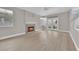Spacious living room with fireplace, light wood floors, and backyard access at 2257 Norway Pine Ct, Las Vegas, NV 89134