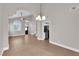 Inviting living room with archway, tile flooring, and bright light fixtures at 2257 Norway Pine Ct, Las Vegas, NV 89134