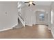 Bright living room with high ceilings, tile floors, staircase, and lots of natural light at 2257 Norway Pine Ct, Las Vegas, NV 89134