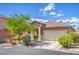 Attractive single-story home with well-kept landscaping, a driveway, and a two-car garage at 2920 Riarosa Ct, North Las Vegas, NV 89086