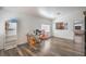 Open concept living room featuring wood-look floors and seamlessly connecting to the kitchen at 2920 Riarosa Ct, North Las Vegas, NV 89086