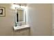 Bright bathroom featuring a vanity with a modern, illuminated mirror at 2926 E Eldorado Ln, Las Vegas, NV 89120