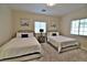 Comfortable bedroom with two beds, soft carpet, and bright natural light at 2926 E Eldorado Ln, Las Vegas, NV 89120
