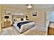 Bedroom features a comfortable bed with nightstands and stylish lamps and neutral walls at 2926 E Eldorado Ln, Las Vegas, NV 89120