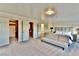 Spacious bedroom with a neutral sofa, modern bed, and well-organized closet spaces at 2926 E Eldorado Ln, Las Vegas, NV 89120