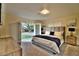 Bedroom featuring dresser, outdoor access, carpet, a modern bed, and light neutral walls at 2926 E Eldorado Ln, Las Vegas, NV 89120