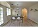 Bright dining room with wood floors, and an open concept to the living room at 2926 E Eldorado Ln, Las Vegas, NV 89120