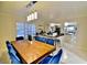 Dining room with a large wood table and seating, showcasing view into the kitchen at 2926 E Eldorado Ln, Las Vegas, NV 89120