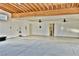 Inside the garage, with generous square footage, featuring dual ceiling fans and a work area at 2926 E Eldorado Ln, Las Vegas, NV 89120