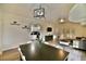 Open concept living room with wood floors, a kitchen, and bright dining room at 2926 E Eldorado Ln, Las Vegas, NV 89120