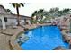 Outdoor pool area with rock waterfall feature, lounge chairs and patio at 2926 E Eldorado Ln, Las Vegas, NV 89120