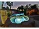 Evening shot of the stunning pool and spa area, beautifully illuminated, creating a serene outdoor oasis at 2926 E Eldorado Ln, Las Vegas, NV 89120