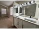 Bathroom featuring double sink vanity with modern fixtures and ample lighting at 3005 Treasure Island Rd, Las Vegas, NV 89128