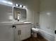 Bright bathroom with a stylish vanity, toilet, and a shower-tub combo at 3005 Treasure Island Rd, Las Vegas, NV 89128